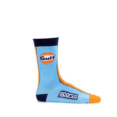 Flat lay top view of the Sparco Gulf Heritage Socks showing the Sparco and Gulf logos on the top and sole of each sock.